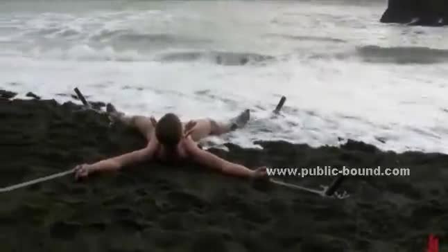 Young gay twink bound in ropes on a beach and used like a slave t